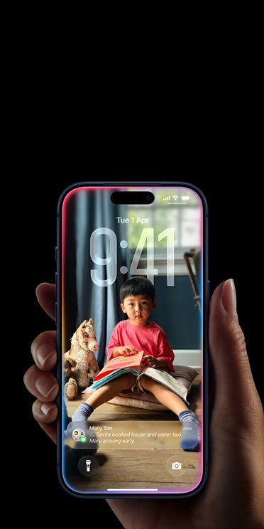 Hand holding iPhone 17 Pro, Message pop-up on personalised Lock Screen